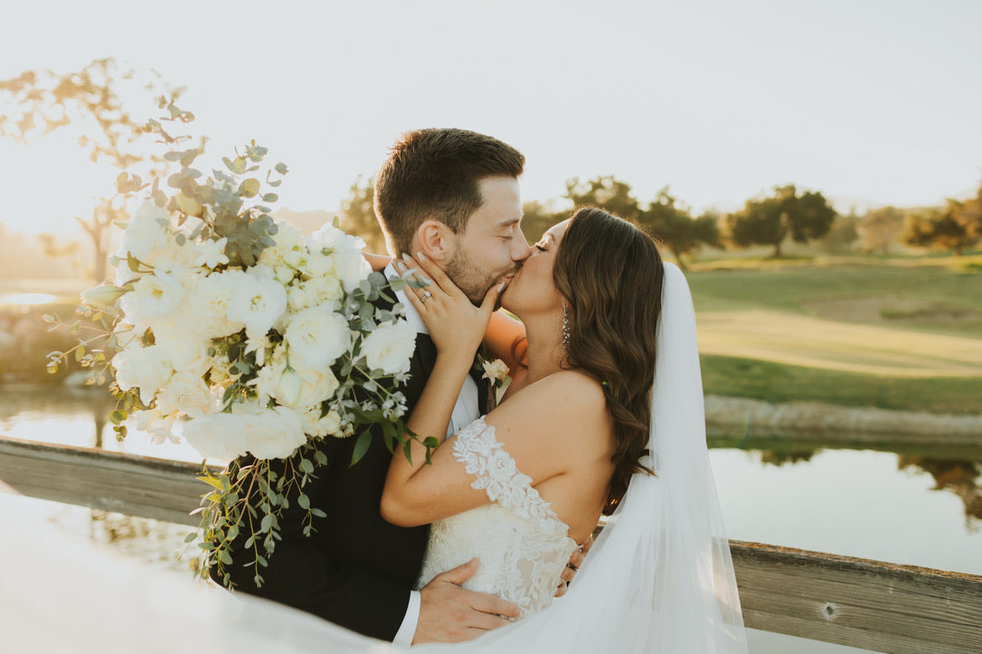 Bride and Groom at Santa Barbara Wedding with White Florals